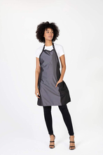 Load image into Gallery viewer, Betty Dain Bleach Proof Hourglass Salon Stylist Apron, Flattering Cut, Stylish Colorblock, Durable Fabric, Water, Color, and Chemical Proof, Zipper Pockets, Adjustable Neck Closure, Black/Pewter

